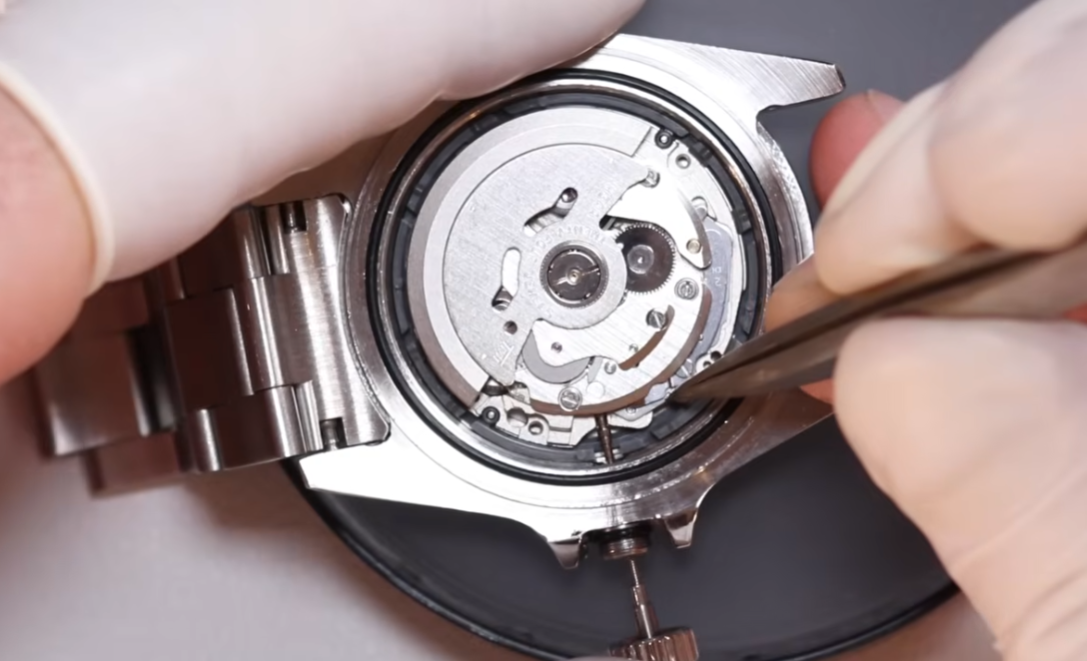 Watchmaker hand-assembling movement in Portugal